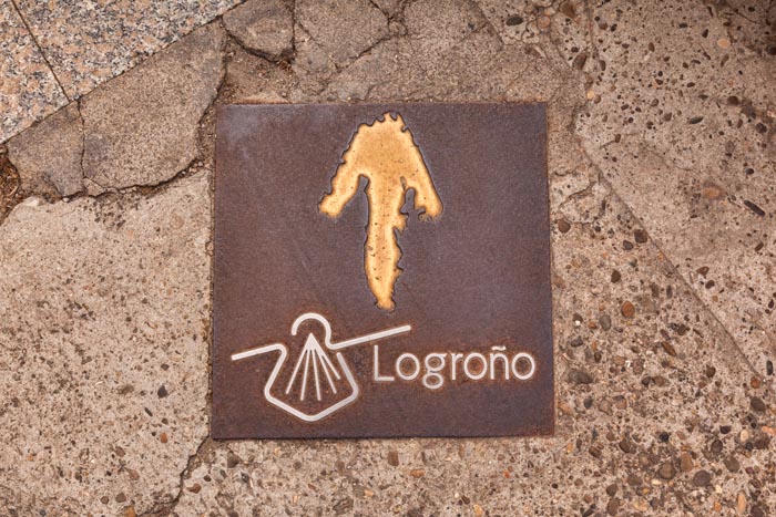Pavement sign for the Camino de Santiago, or Pilgrims Way, which passes through the city of Logrono, La Rioja, Spain.