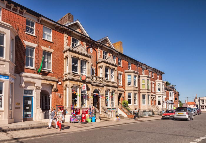 A sunny summer day in the High Street, Southwold, Suffolk, England.
