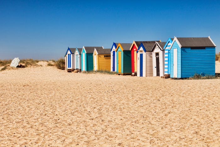 Beach huts on the beach at Southwold, Suffolk, England.