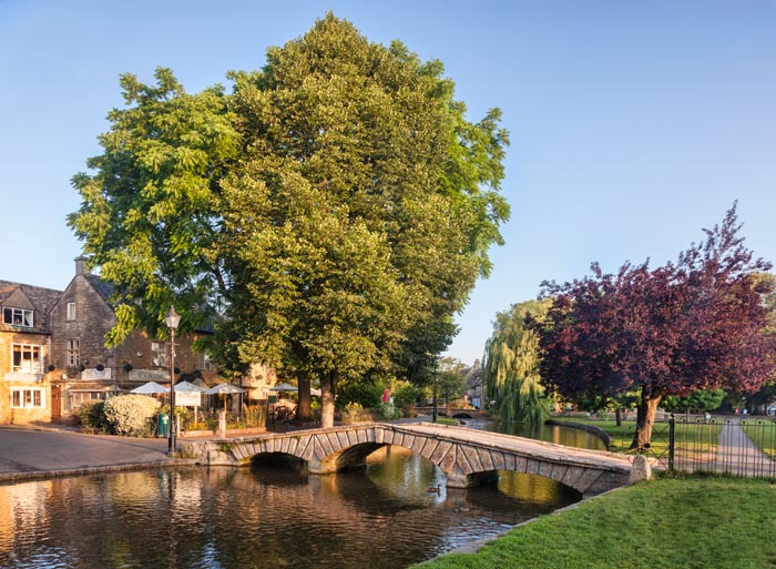 The famous bridge over the River Windrush in the Cotswolds village of Bourton-on-the-Water, Gloucestershire, England