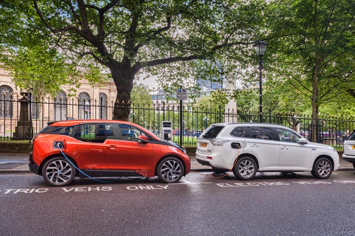 Electric cars being charged in the centre of Birmingham, West Midlands, England