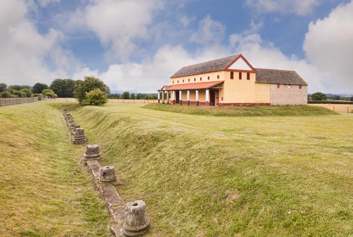 Wroxeter replica Roman Town House, and a ditch showing the bases of original columns and their depth below the current surface.