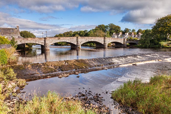 Bridge and weir on the River Cree at Newton Stuart, in The Machars region, Dumfries and Galloway, Scotland.