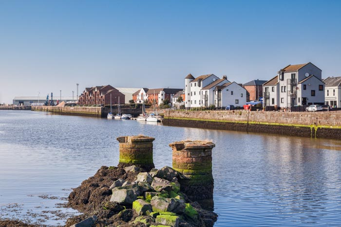 View from the New Bridge over the River Ayr towards the sea, over the piers of the former railway bridge, at Ayr, South Ayrshire, Scotland.