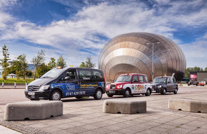 Taxi cabs at the Imax Cinema, Glasgow, Scotland.