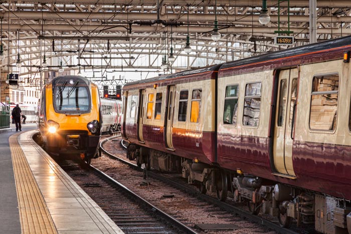Train approaching platform, Glasgow Central Station, Glasgow, Scotland, UK.