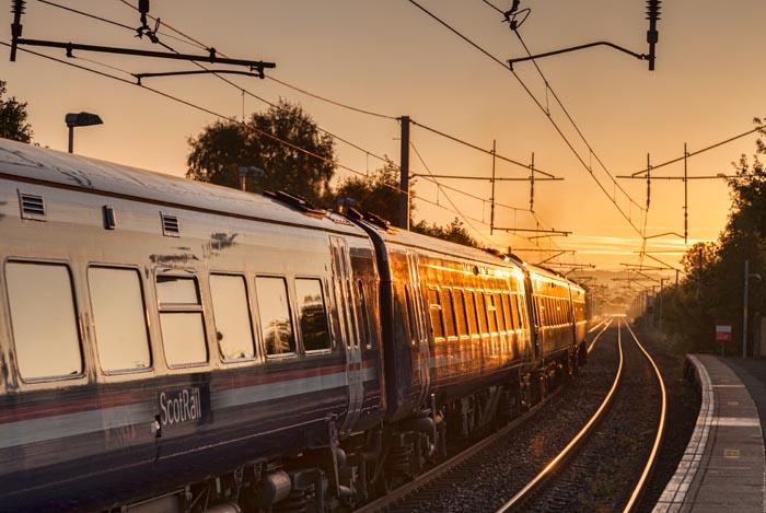 ScotRail train at station, early morning.