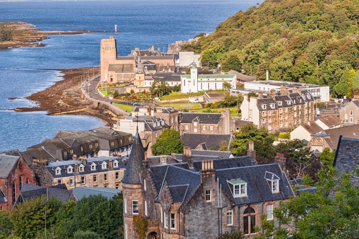 Oban from McCaigs Tower, with St Columba's Roman Catholic Cathedral on the waterfront, Oban, Argyll and Bute, Scotland, UK.