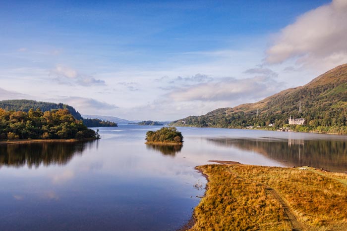 Loch Awe, and a distant view to the Loch Awe Hotel, Argyll and Bute, Scotland, UK.