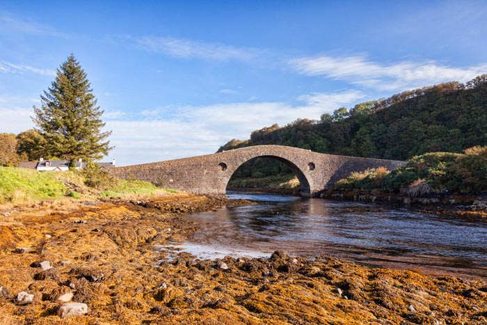 The Clachan Bridge, known as the Bridge Over the Atlantic, which connects the Scottish mainland with the Island of Seil, Argyll and Bute, Scotland, UK.