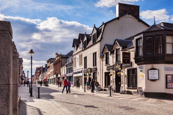 Shoppers and tourists in the High Street, Fort William, Highland, Scotland, UK