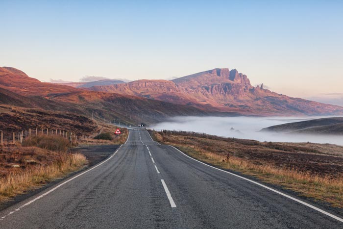 The open road on a misty autumn morning at The Storr, Isle of Skye, Inner Hebrides, Scotland, UK