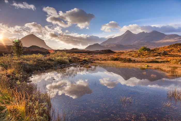 The Cuillins, autumn, at sunrise, reflected in a pool of water, Isle of Skye, Inner Hebrides, Highland, Scotland, UK