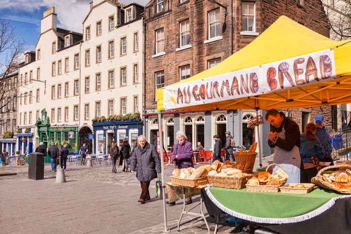 Market stall selling bread in Grassmarket, Edinburgh, Scotland, UK