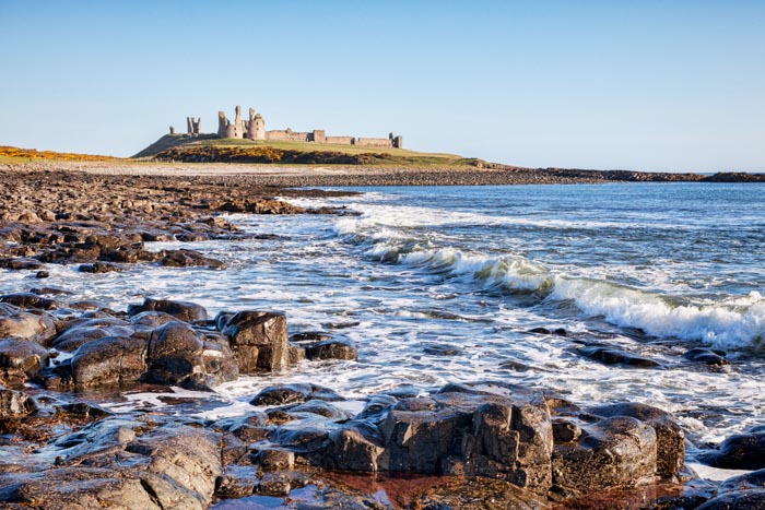 Dunstanburgh Castle on the Northumberland coast, North East England.