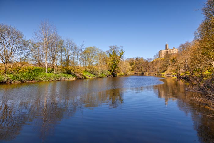 The River Coquet and Warkworth Castle in spring, Warkworth, Northumberland, England, UK