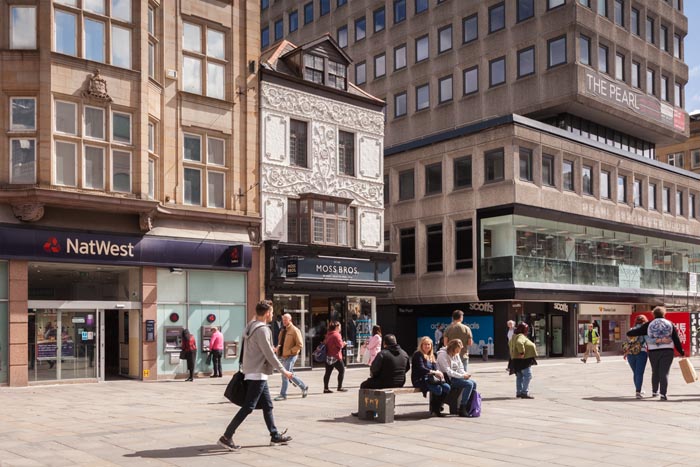 The decoration on the Moss Bros shop in Northumberland Street, is known as Pargetting, and was added in 1953 to celebrate the coronation of Queen Elizabeth II in 1953. Newcastle-upon-Tyne, Tyne and Wear, England, UK