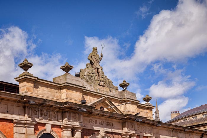 Neptune sculpture on top of the old Fish Market, Newcastle Quays, Newcastle-upon-Tyne, England, UK