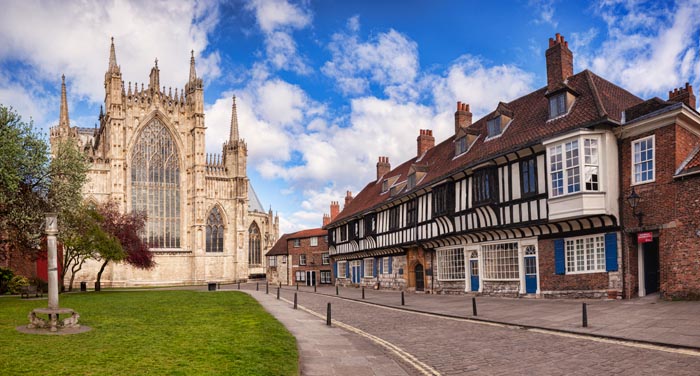 College Street, York, with St William's College on the right and the East facade of York Minster on the left.