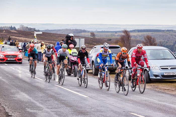 Tour de Yorkshire 2016, the lead riders racing up Blakey Ridge, above Farndale, North York Moors National Park, Yorkshire, England, UK