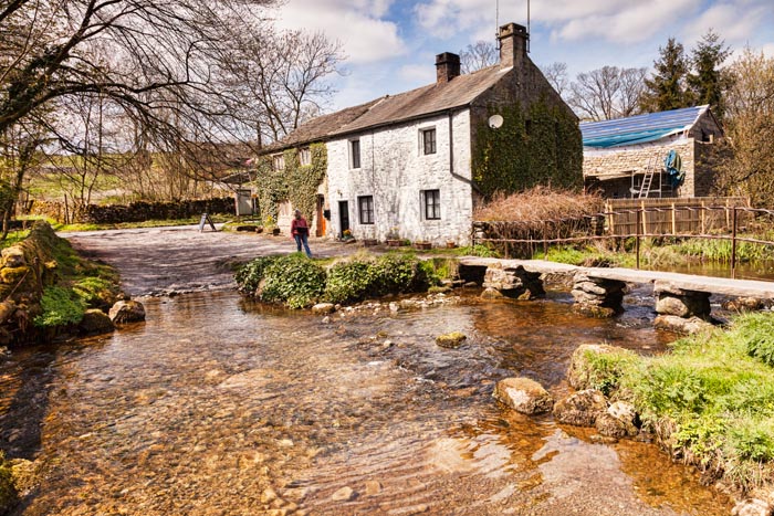 Cottages in the village of Malham, and the ford at the Malham Beck, Yorkshire Dales National Park, North Yorkshire, England, UK