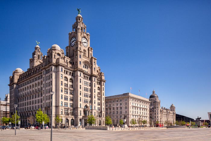 The 'Three Graces', historic buildings which dominate the Liverpool waterfront at Pier Head. They are the Royal Liver Building, the Cunard Building and the Port of Liverpool Building.