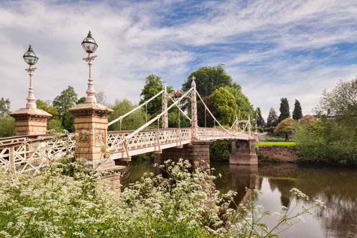 Victoria Bridge, a footbridge over the River Wye in Hereford, with Cow Parsley (Anthriscus Sylvestris) in the foreground, Herefordshire, England, UK