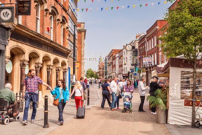 People shopping in Worcester High Street, Worcestershire, England, UK