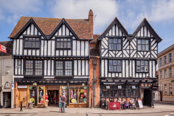 Shops in half-timbered buildings in Bridge Street, Stratford-upon-Avon, Warwickshire, England, UK