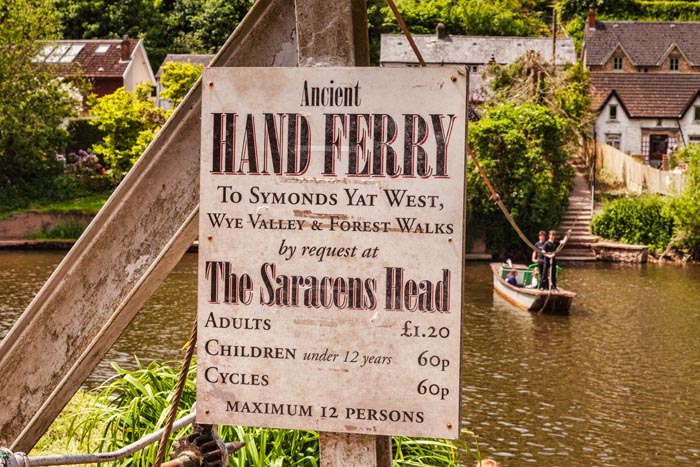 Sign for the Hand Ferry at Symonds Yat, with the boat in the background, Gloucestershire, England, UK