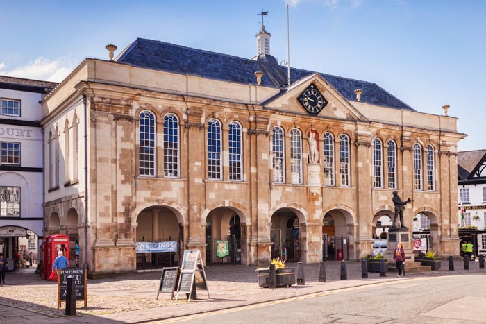 Monmouth Shire Hall, with its statue of Henry V, born at Monmouth in 1387, and also Charles Rolls, co-founder of Rolls Royce, in Agincourt Square, Monmouthshire, Wales, UK