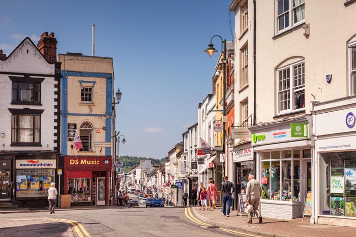 Shopping in Monmouth, a view from Agincourt Square into Monnow Street, Monmouthshire, Wales, UK