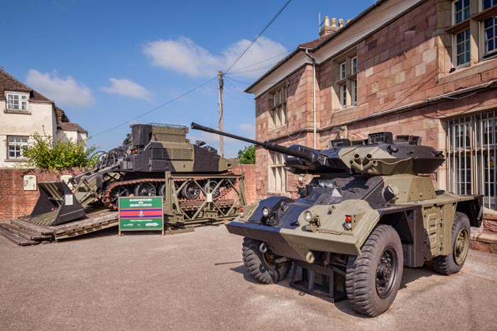 A FV721 Fox armoured car and a FV180 Combat Engineer Tractor outside the Headquarters and Museum of the Royal Monmouthshire Royal Engineers (Militia), the most senior Regiment of the British Army Reserve, at Monmouth Castle, Monmouthshire, Wales,UK.
