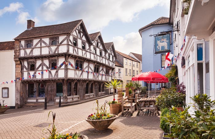 The medieval square in Axbridge, Somerset, England, UK. The half timbered building is King John's Hunting Lodge, now the museum.