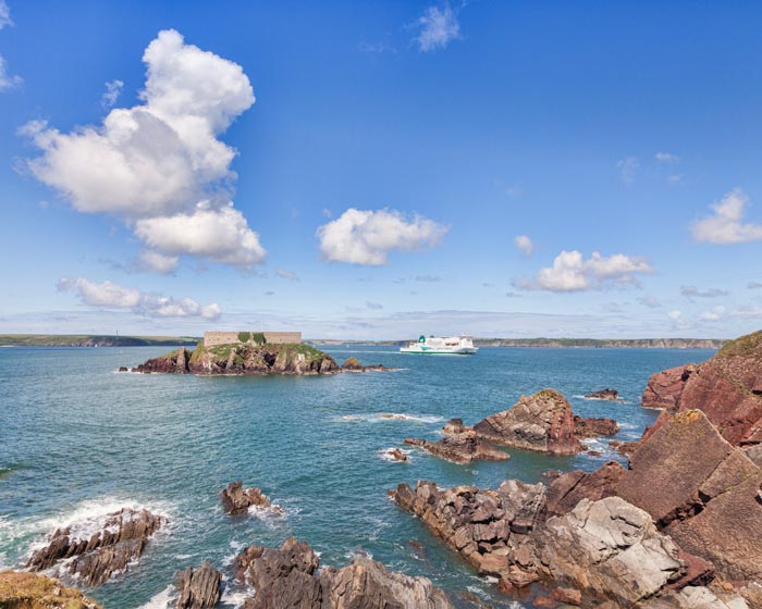 Irish Ferries ferry Isle of Inishmore passes Thorn Island Fort as it sails into Milford Haven to approache Pembroke Dock.
