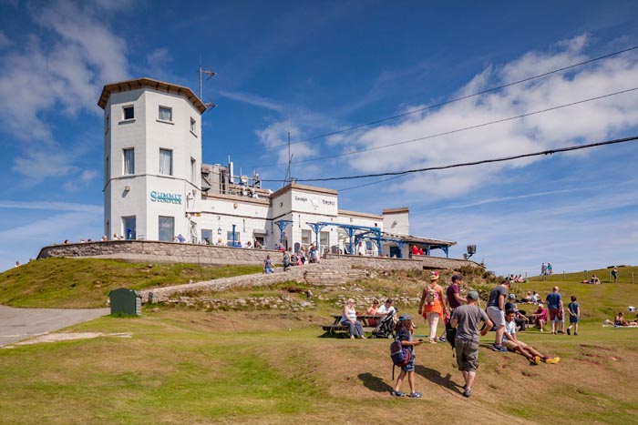 Llandudno, Conwy Wales, UK: 15 August 2016 - Summer finally arrives on the North Wales coast, and everyone gets out to enjoy the sunshine. Here crowds are at the summit of the Great Orme's Head.