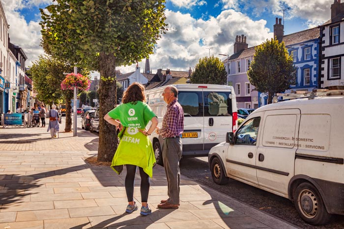 Collecting for Oxfam in the street at Cockermouth, Cumbria, UK