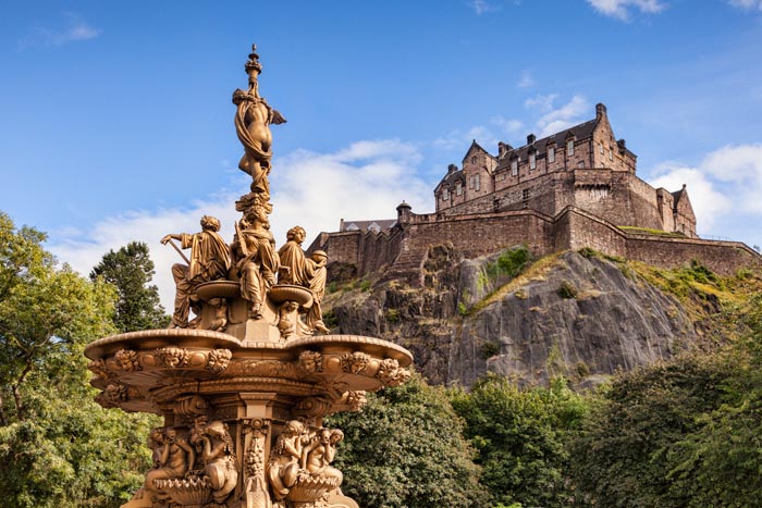 The Ross Fountain in Princes Street Gardens, and Edinburgh Castle, Scotland, UK.