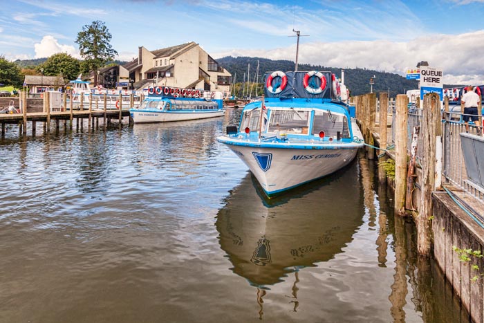 Cruise boats at the pier on Lake Windermere, Lake District National Park, Cumbria, England, UK