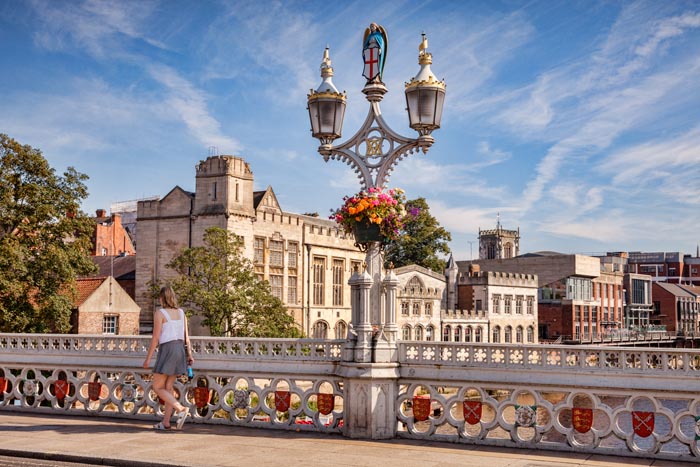 Lamp standard on the Lendal Bridge, and York Guildhall, York, North Yorkshire, England, UK